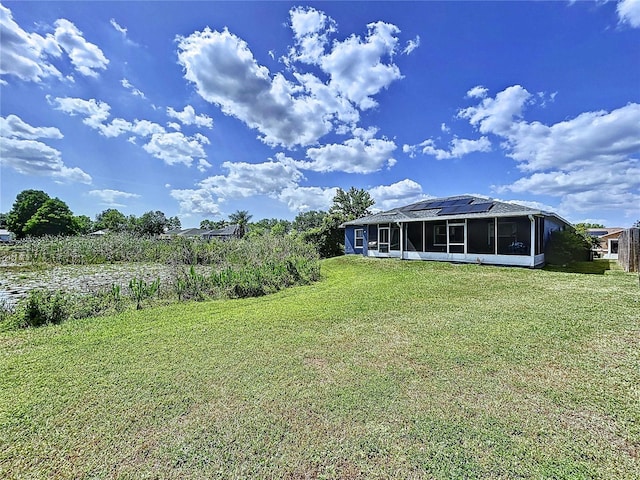 view of yard with a sunroom