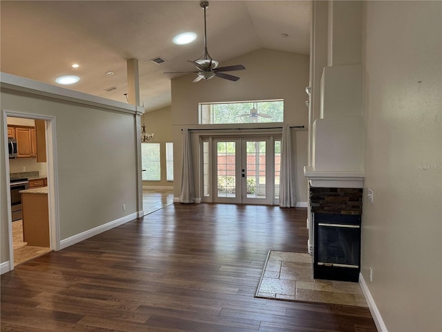 1608 Fox Glen Ct, Winter Springs, FL 32708 - unfurnished living room with a ceiling fan, a stone fireplace, visible vents, high vaulted ceiling, and dark wood-type flooring