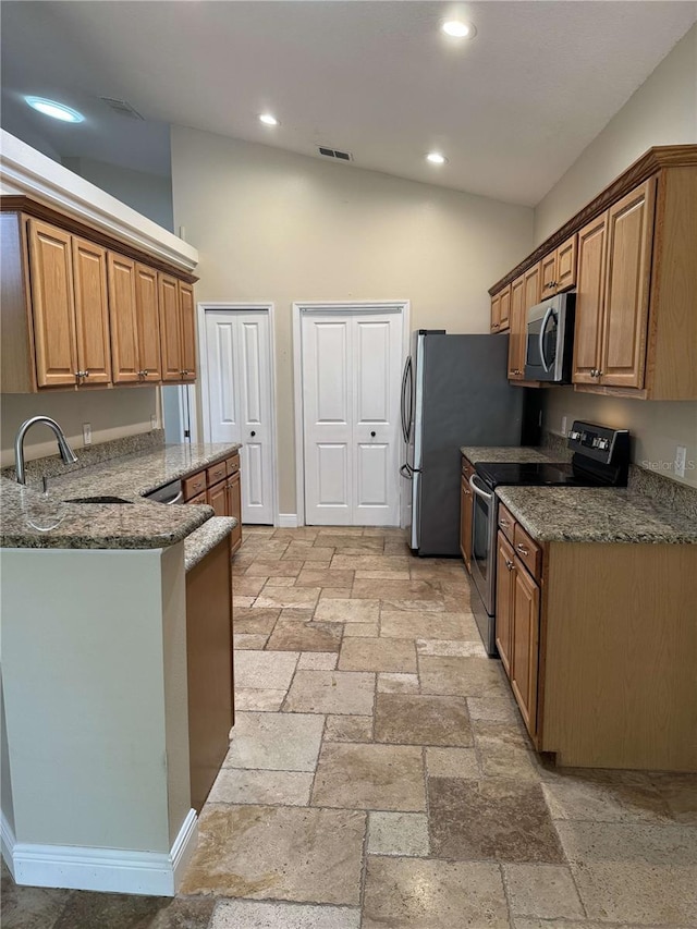 1608 Fox Glen Ct, Winter Springs, FL 32708 - kitchen with a sink, dark stone counters, stainless steel appliances, stone tile floors, and visible vents