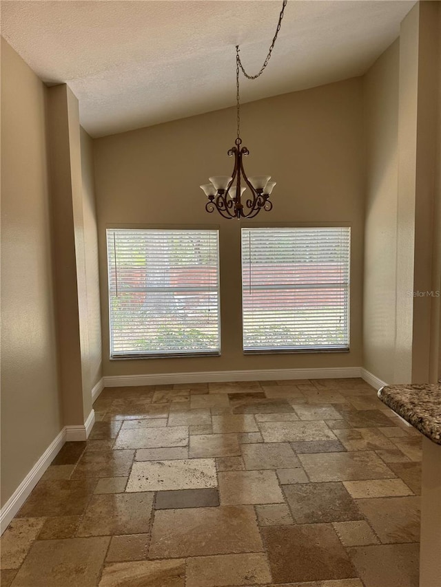 1608 Fox Glen Ct, Winter Springs, FL 32708 - unfurnished dining area featuring stone tile flooring, a wealth of natural light, baseboards, and a notable chandelier