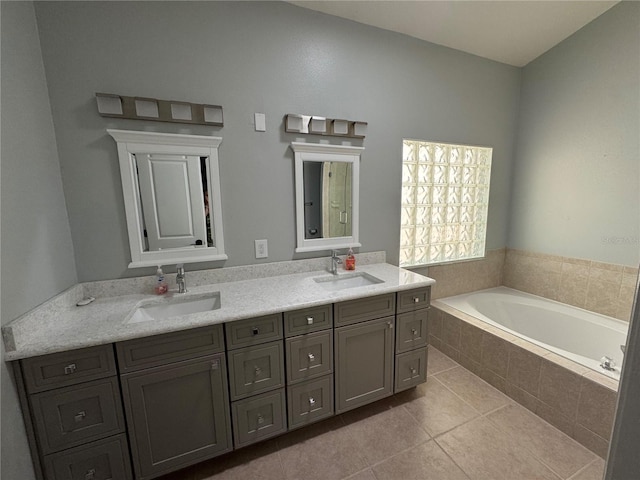 1608 Fox Glen Ct, Winter Springs, FL 32708 - bathroom with double vanity, a garden tub, tile patterned flooring, and a sink
