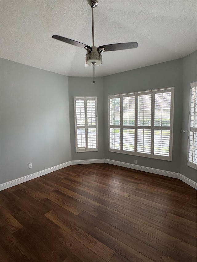1608 Fox Glen Ct, Winter Springs, FL 32708 - spare room with a textured ceiling, baseboards, dark wood-style flooring, and a ceiling fan