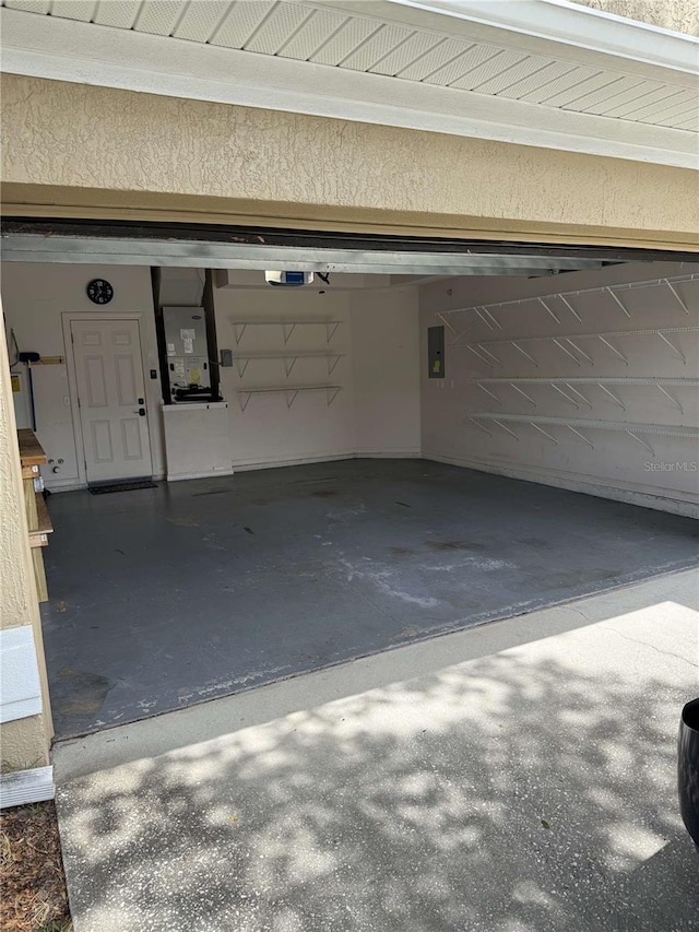 1608 Fox Glen Ct, Winter Springs, FL 32708 - garage with heating unit, electric panel, and a garage door opener