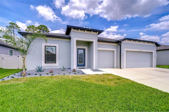 18657 Obregan Dr, Spring Hill, FL 34610 - prairie-style house featuring a garage, stucco siding, and driveway