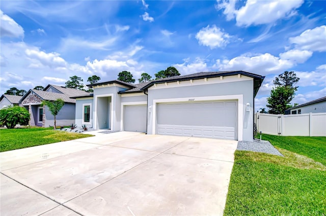 18657 Obregan Dr, Spring Hill, FL 34610 - view of front facade featuring concrete driveway, a garage, and stucco siding