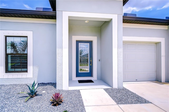 18657 Obregan Dr, Spring Hill, FL 34610 - doorway to property with stucco siding and an attached garage