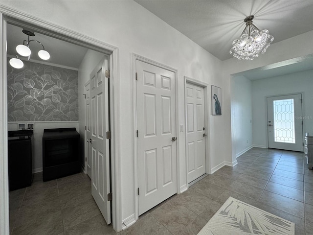 18657 Obregan Dr, Spring Hill, FL 34610 - tiled entrance foyer featuring a chandelier, baseboards, and wallpapered walls