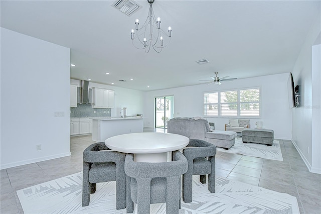 18657 Obregan Dr, Spring Hill, FL 34610 - dining room with light tile patterned floors, ceiling fan, a chandelier, baseboards, and recessed lighting