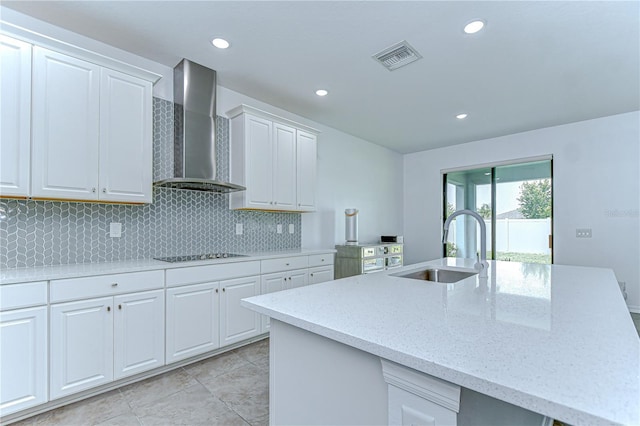 18657 Obregan Dr, Spring Hill, FL 34610 - kitchen featuring wall chimney exhaust hood, a sink, black electric stovetop, light stone counters, and tasteful backsplash