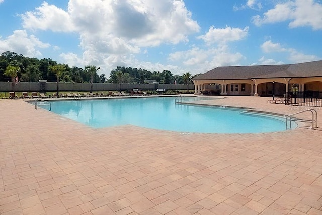 18657 Obregan Dr, Spring Hill, FL 34610 - community pool featuring a patio area