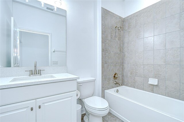 18657 Obregan Dr, Spring Hill, FL 34610 - bathroom with toilet, vanity, and bathtub / shower combination