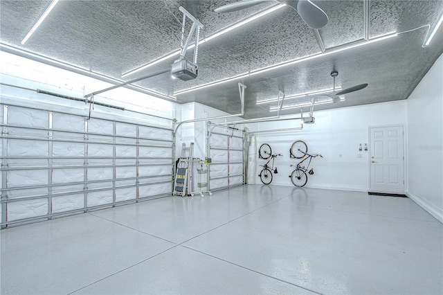 18657 Obregan Dr, Spring Hill, FL 34610 - garage with a garage door opener and baseboards