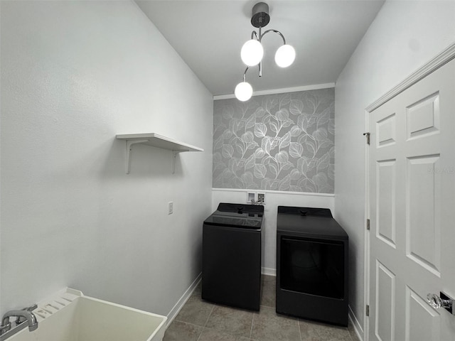 18657 Obregan Dr, Spring Hill, FL 34610 - laundry area with baseboards, washing machine and dryer, and tile patterned flooring