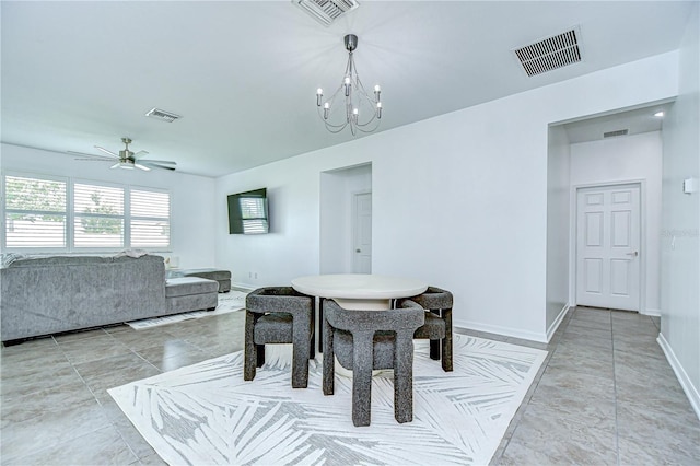 18657 Obregan Dr, Spring Hill, FL 34610 - dining area featuring baseboards, a chandelier, and ceiling fan