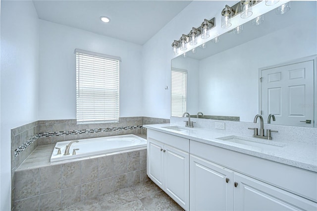 18657 Obregan Dr, Spring Hill, FL 34610 - bathroom with double vanity, a bath, plenty of natural light, and tile patterned floors
