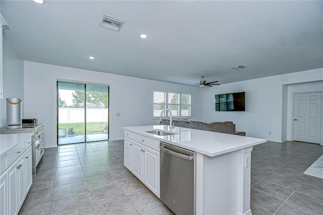 18657 Obregan Dr, Spring Hill, FL 34610 - kitchen featuring dishwasher, a sink, open floor plan, ceiling fan, and light stone countertops