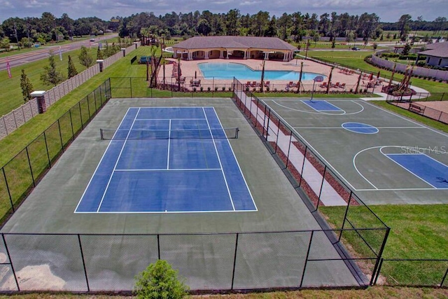 18657 Obregan Dr, Spring Hill, FL 34610 - drone / aerial view of a pool area and a tree filled landscape