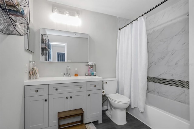 full bathroom with toilet, vanity, wood finished floors, and shower / bathtub combination with curtain