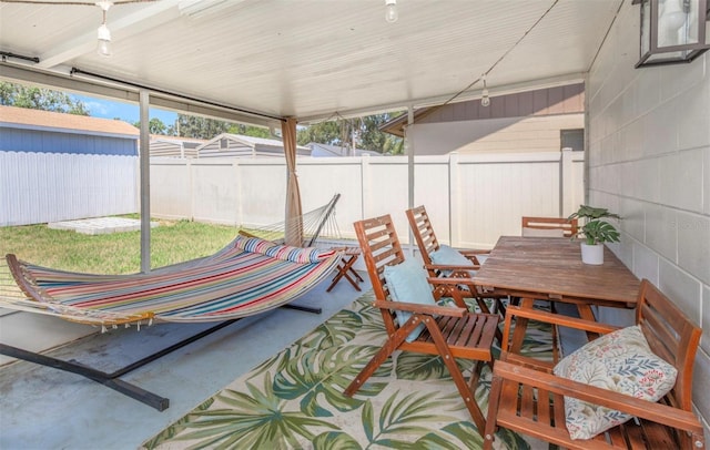 sunroom with outdoor dining space