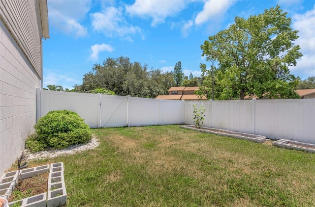 view of yard with a fenced backyard