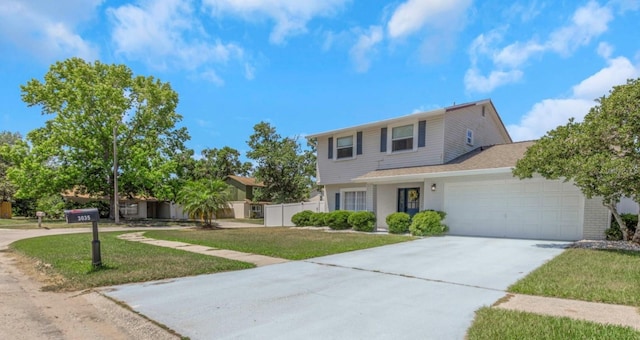 traditional home with an attached garage, driveway, fence, and a front yard
