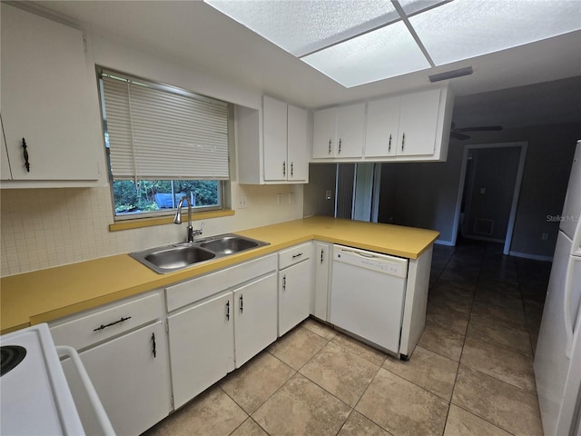 kitchen featuring a sink, white cabinetry, light countertops, and dishwasher