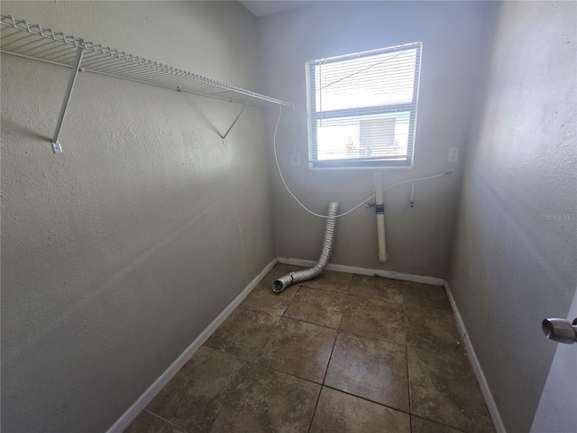 washroom featuring baseboards and laundry area