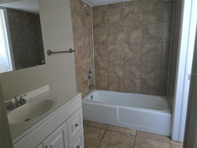 bathroom featuring shower / bath combination, tile patterned floors, and vanity