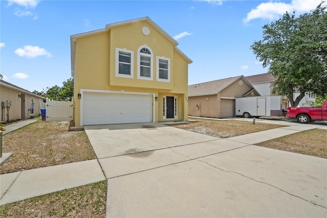 11323 Ivy Flower Loop, Riverview, FL 33578 - view of front of house featuring concrete driveway, stucco siding, and a garage