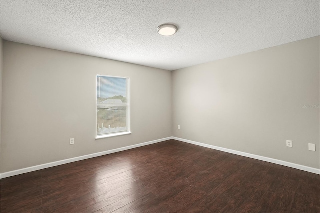 11323 Ivy Flower Loop, Riverview, FL 33578 - unfurnished room featuring dark wood finished floors, baseboards, and a textured ceiling