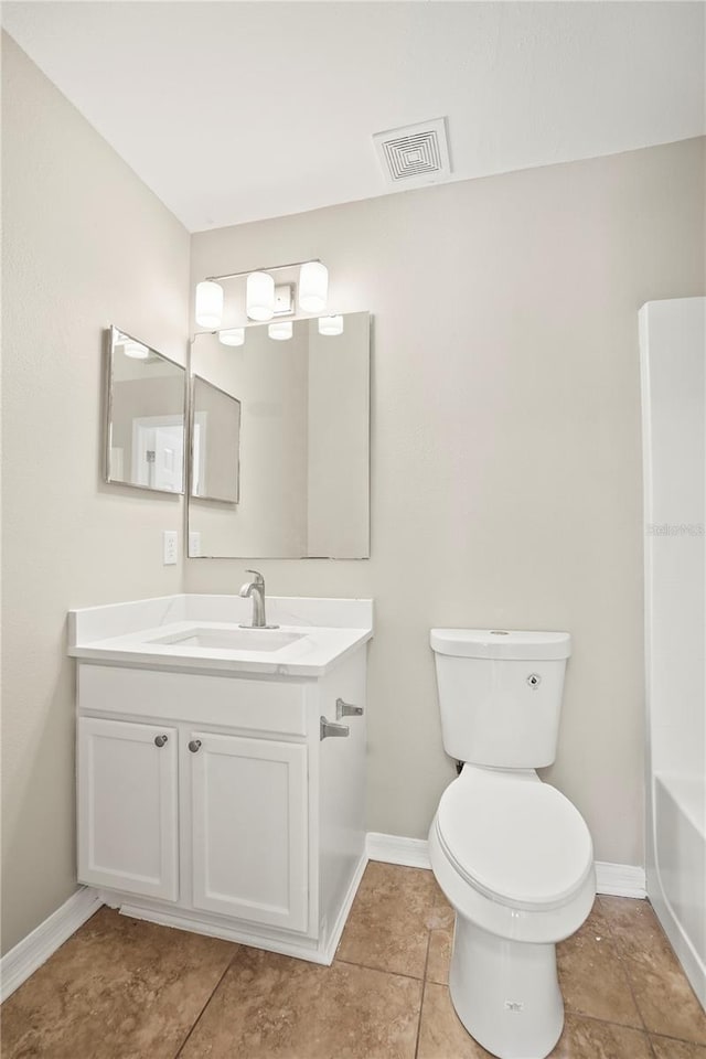11323 Ivy Flower Loop, Riverview, FL 33578 - full bath with baseboards, toilet, vanity, and visible vents