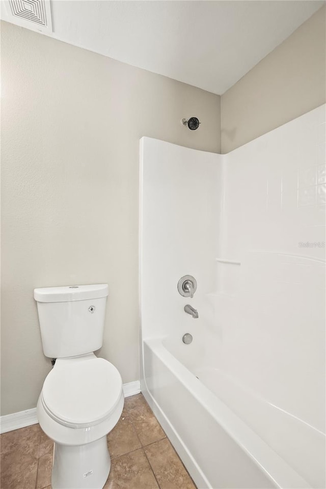 11323 Ivy Flower Loop, Riverview, FL 33578 - bathroom featuring toilet, visible vents, tile patterned floors, shower / bath combination, and baseboards