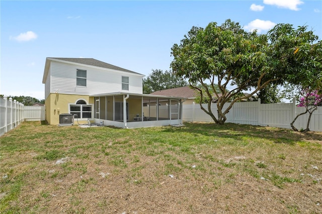 11323 Ivy Flower Loop, Riverview, FL 33578 - rear view of house featuring a sunroom, central AC unit, a lawn, and a fenced backyard