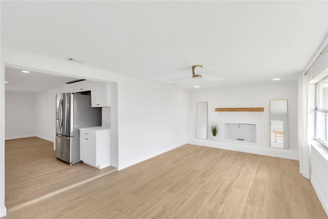 13612 Veronica Dr, Hudson, FL 34667 - unfurnished living room with light wood-style floors, a ceiling fan, baseboards, and recessed lighting