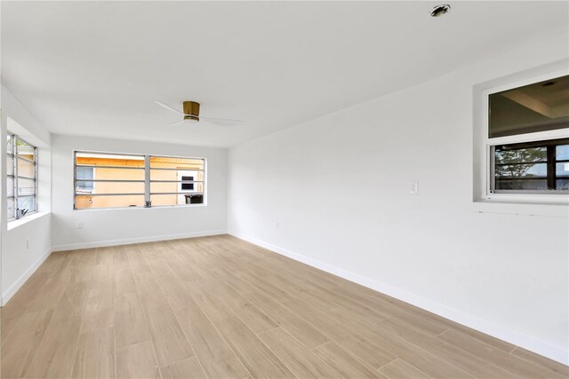 13612 Veronica Dr, Hudson, FL 34667 - empty room with light wood-type flooring, ceiling fan, and baseboards
