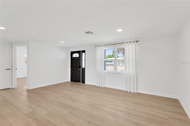13612 Veronica Dr, Hudson, FL 34667 - foyer featuring recessed lighting, light wood-style flooring, and baseboards