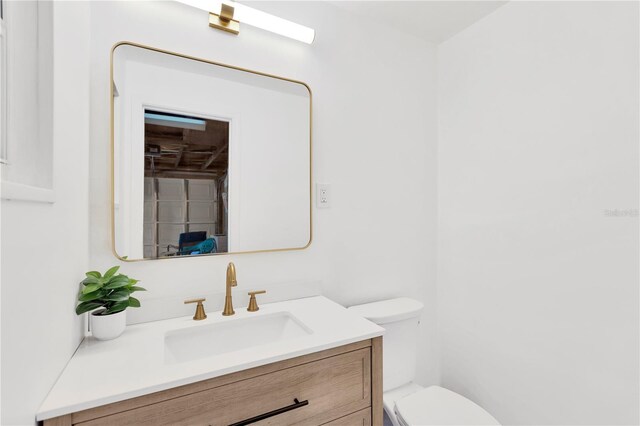 13612 Veronica Dr, Hudson, FL 34667 - bathroom featuring toilet and vanity