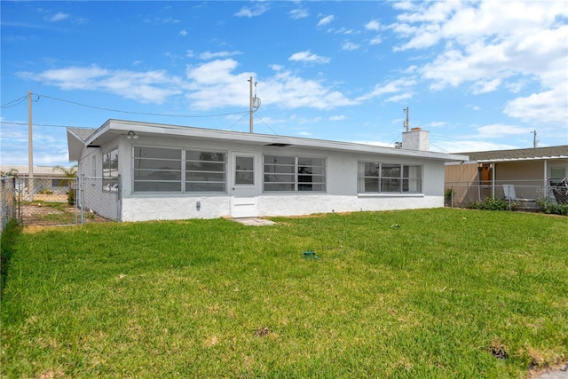 13612 Veronica Dr, Hudson, FL 34667 - rear view of house with stucco siding and a chimney