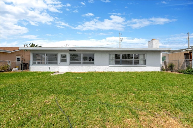 13612 Veronica Dr, Hudson, FL 34667 - back of house with stucco siding and a chimney