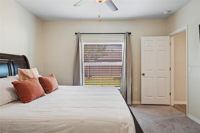 carpeted bedroom with baseboards and ceiling fan