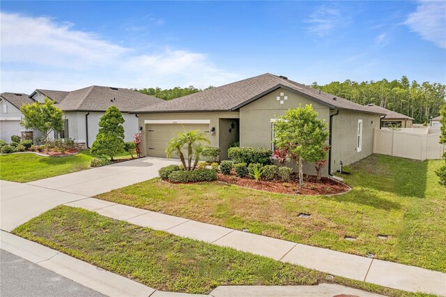 view of front facade featuring an attached garage, concrete driveway, and stucco siding