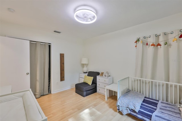 bedroom featuring light wood-style floors