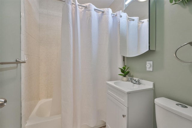 bathroom featuring toilet, shower / tub combo, and vanity