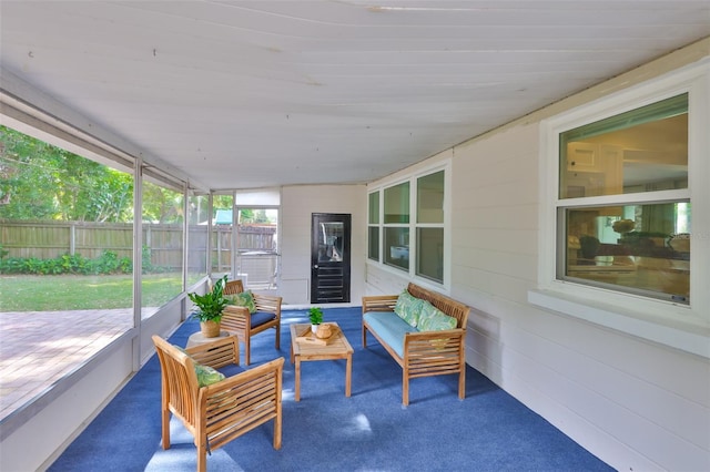 sunroom featuring outdoor lounge area