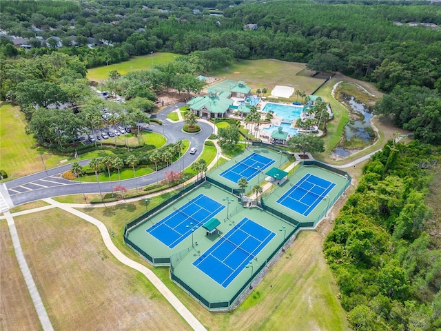 birds eye view of property featuring a wooded view