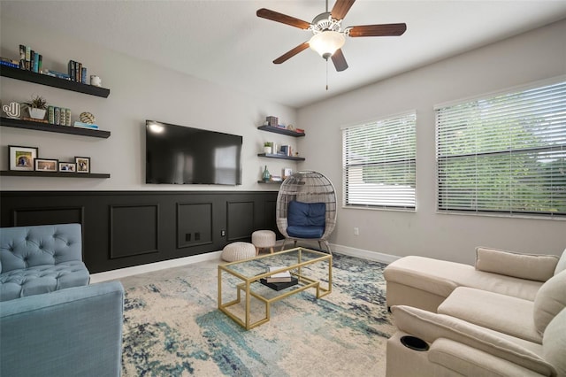 living area with a ceiling fan