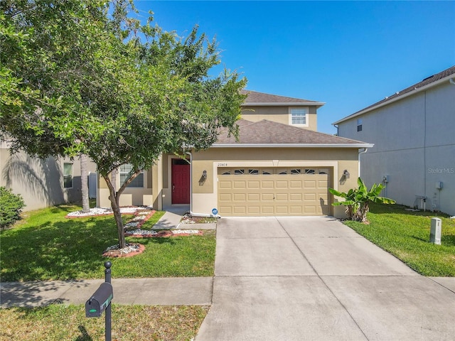 20404 Autumn Fern Ave, Tampa, FL 33647 - view of front of house with an attached garage, stucco siding, a front lawn, and concrete driveway