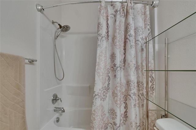 bathroom with toilet and shower / tub combo with curtain