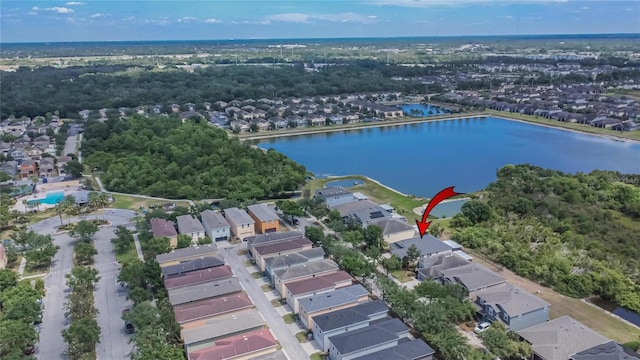 birds eye view of property with a water view and a residential view