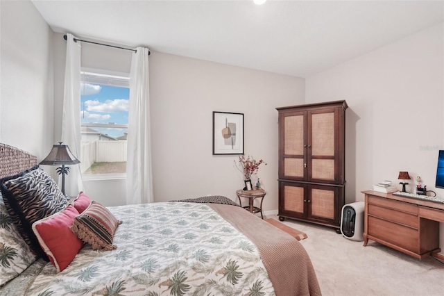bedroom with light colored carpet